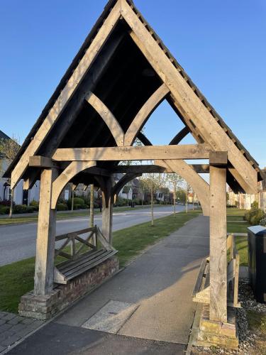 a wooden pavilion on the side of a road at Seascape Apartment in Filey