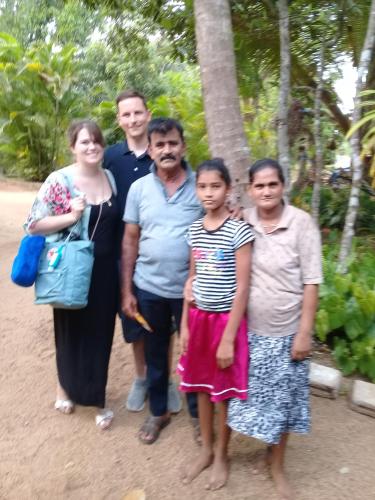 a group of people posing for a picture at Amba Sewana Homestay in Sigiriya