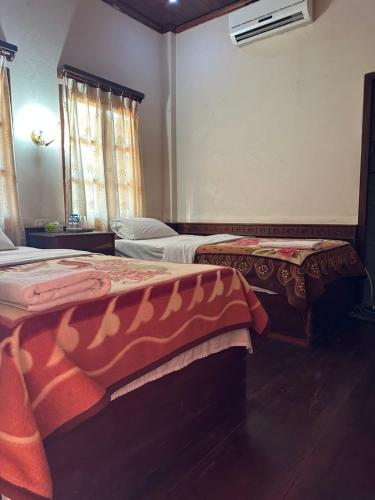 Łóżko lub łóżka w pokoju w obiekcie BKC Villa 2