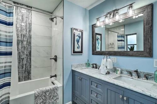 a bathroom with a tub and a sink and a shower at NEW! Cheerful bungalow with hot tub near beaches in Bay Pines