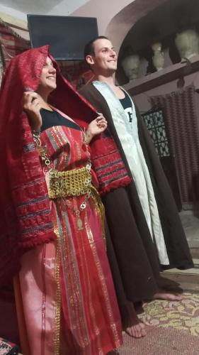 a man and a woman standing next to each other at Dar Fatma Toujane in Tūjān