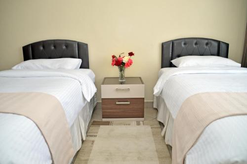 Postel nebo postele na pokoji v ubytování Norfolk Towers Serviced Apartment -Nairobi, City Centre CBD