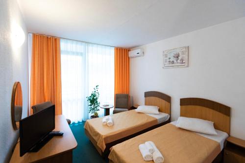Postel nebo postele na pokoji v ubytování Hotel Siret Saturn