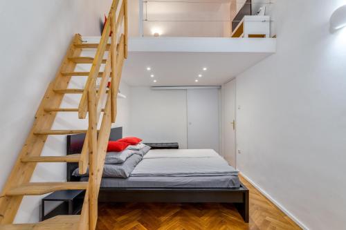 A bed or beds in a room at Little Cola apartment in Dohány street with AC