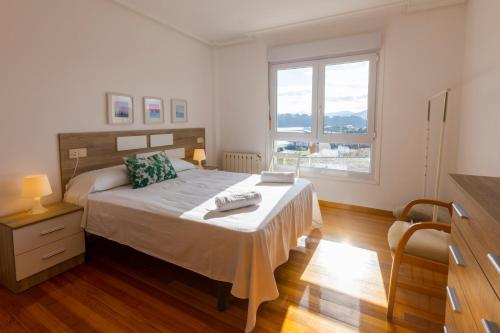Postel nebo postele na pokoji v ubytování Apartagal-Edificio Celtas Foz