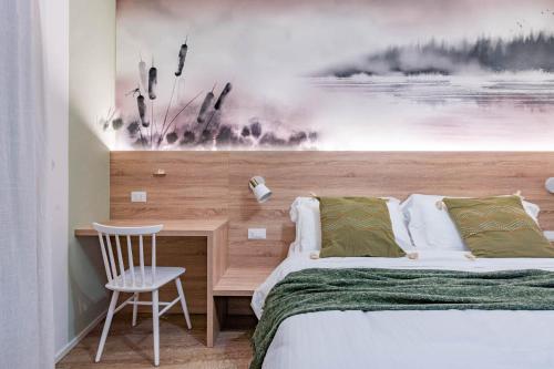 Postel nebo postele na pokoji v ubytování Casa Mao' di TSS' - NUOVA wellness privata ,Ideale per Famiglie e Gruppi vicino al Lago di Caldonazzo