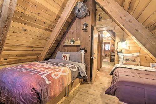 a bedroom with a bed in a log cabin at Private Hot Tub Quintessential Tahoe Cabin in South Lake Tahoe