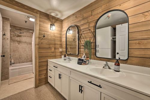 a bathroom with a sink and a mirror at Ski-InandSki-Out Boyne Mountain Resort Rental! in Boyne Falls