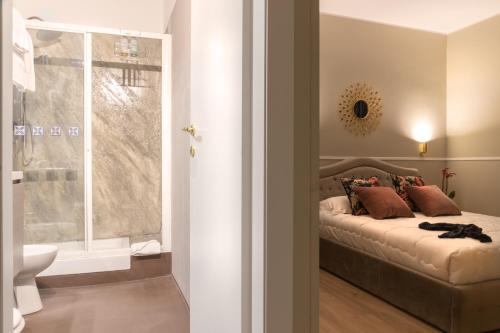 Llit o llits en una habitació de Fair Suite Roma Termini