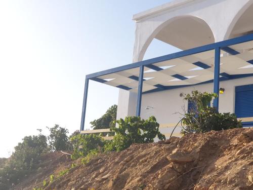 a house on top of a hill at Sea View Holiday House in Archangelos