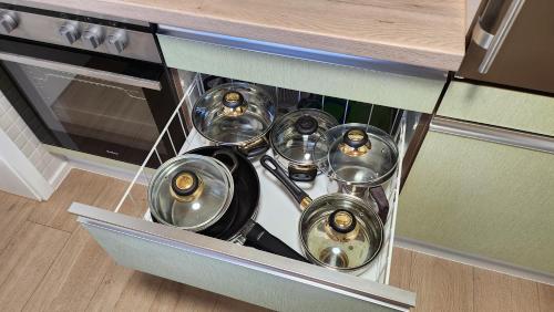 a bunch of pots and pans in an oven at Allgäunest in Leutkirch im Allgäu
