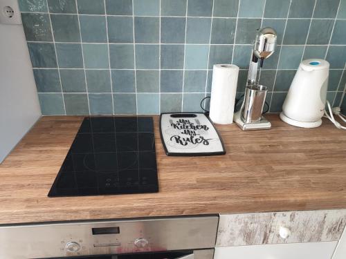 a kitchen counter with a cutting board on a counter top at Sea View Holiday House in Archangelos