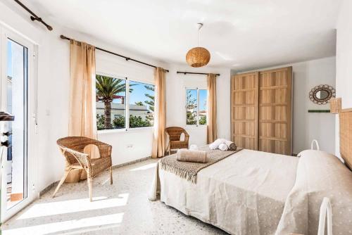 A bed or beds in a room at Villa El Algarrobo