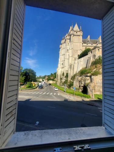a view of a building from a window at Maison au pied du château in Châteaudun