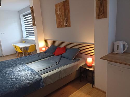 Postel nebo postele na pokoji v ubytování BIG BLUE Apartments - 2 osobowy