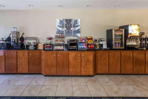a store with wooden counters with food on them at Wingate by Wyndham Houma in Houma