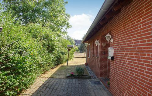 a brick building with a brick walkway next to a building at 2 Bedroom Gorgeous Home In Uetze in Uetze