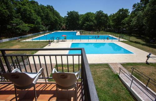 a view of a swimming pool from a balcony at CAMPING ETXARRI in Echarri-Aranaz