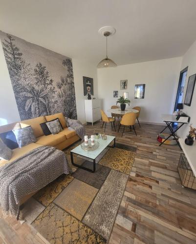 a living room with a couch and a table at Marina 4 ou 8 ou 9 in Narbonne