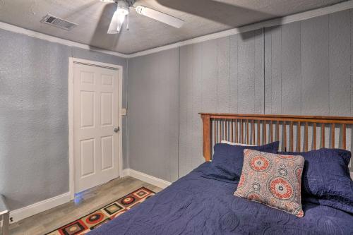a bedroom with a bed and a ceiling fan at Shreveport Vacation Rental Near Riverfront in Shreveport