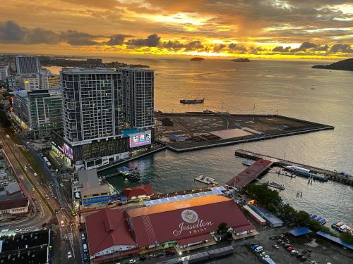 an aerial view of a city with a body of water at Jesselton Point Seaview Homestay Kota Kinabalu in Kota Kinabalu