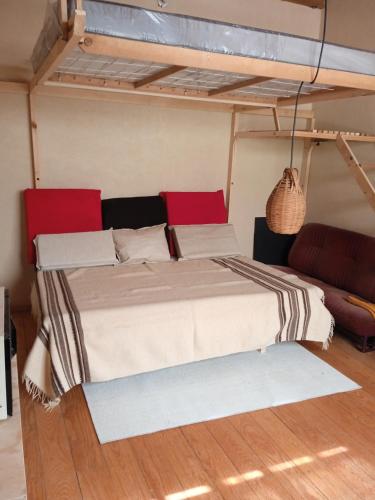 a bedroom with a large bed and a couch at Casa Campestre del Mangrullo in Mexico City