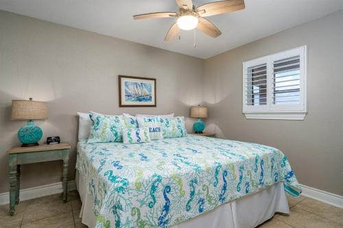 a bedroom with a bed and a ceiling fan at LR 213 - Four Point Lighthouse in Rockport