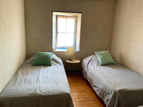 Postel nebo postele na pokoji v ubytování Maison de 2 chambres avec jardin clos et wifi a Saint Jean de Sauves