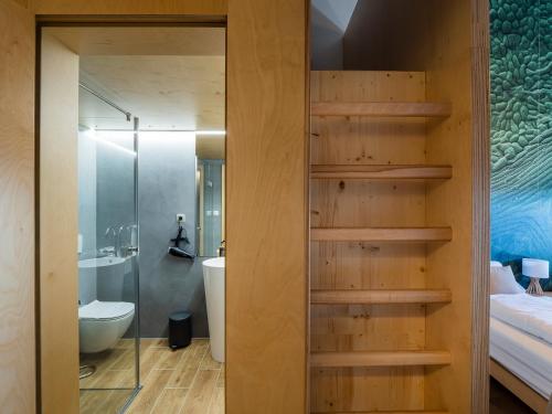 a room with a bathroom with a toilet and a shower at Vinárstvo Predium Vráble in Vráble