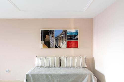 a bedroom with a bed with a white bedspread at Sol de Piedra Apart, Suites & Spa in Cordoba