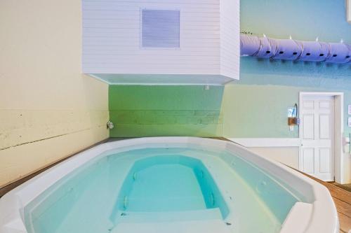 a large bath tub in a room with at Full Moon Condo in Lake Ozark