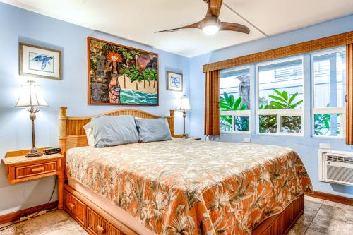 a bedroom with a bed and a window at Kona Riviera Villa #104 in Kailua-Kona