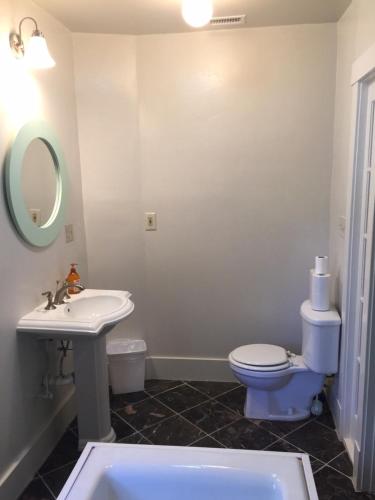 a bathroom with a sink and a toilet and a tub at Ruth House Original Craftsman PETS, walk to State st. in Santa Barbara