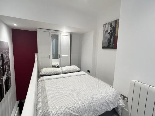 Postel nebo postele na pokoji v ubytování The Snap Pad Boutique Apartment