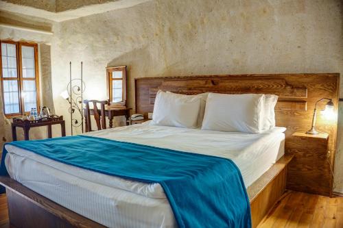 Postel nebo postele na pokoji v ubytování 4 Oda Cave House - Special Class