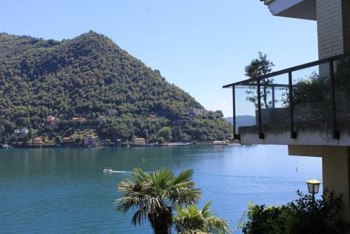 a view of a body of water with a mountain at Lakeviewcabin - King Room With Balcony in Como