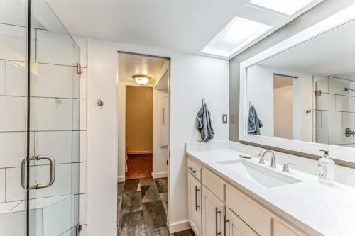 a bathroom with a sink and a mirror at 301 Rochelle in Irving