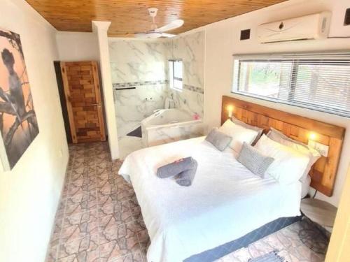 Ένα ή περισσότερα κρεβάτια σε δωμάτιο στο Dream Inn