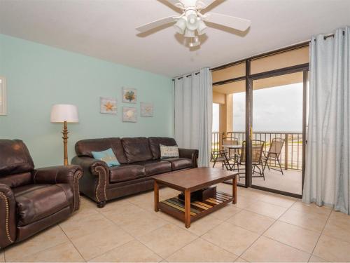 a living room with a couch and a table at Laguna Reef #214 - Retreat on Rockport Bay in Rockport