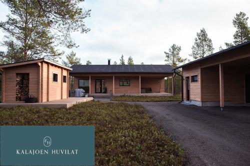 a large house with a building next to it at Hirsihuvila Villa Letto, pihasauna & ulkoporeamme in Kalajoki
