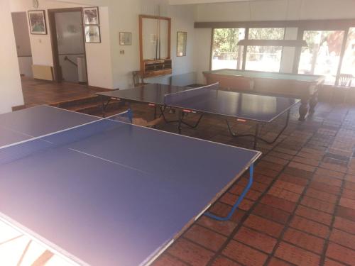 a group of ping pong tables in a room at Rincon del Este Resort in Punta del Este