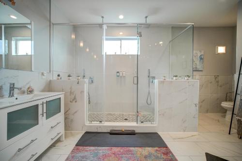 a bathroom with a shower with a glass door at Artsy Hidden Gem ll -Free Parking --- in Philadelphia
