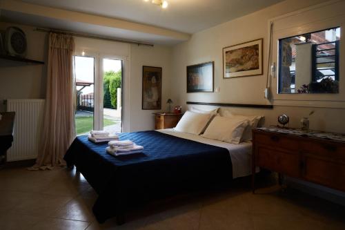 Кровать или кровати в номере Sevasti Country House