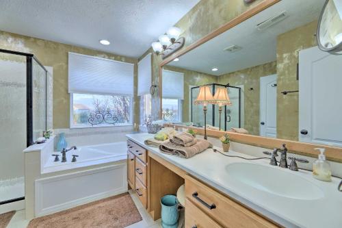 a large bathroom with a tub and a sink and a bath tub at Serene Dayton Vacation Rental with Large Yard! in Dayton