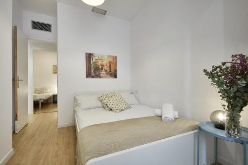 Ένα ή περισσότερα κρεβάτια σε δωμάτιο στο BBarcelona Clot Apartments