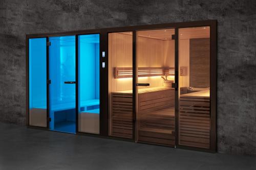 a room with three glass doors with a bed at Villa Absolute privacy in Novigrad Istria