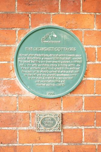a plaque on the side of a brick wall at Coventry Historic Houses in Coventry