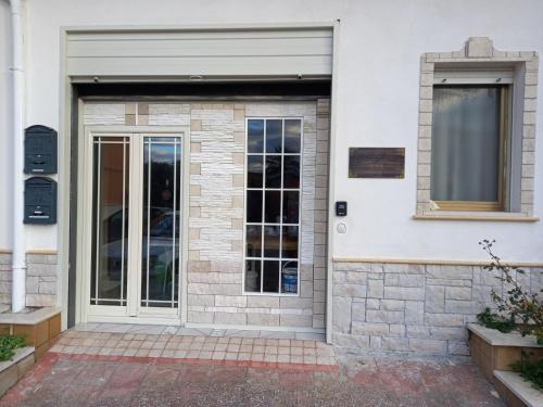 a front door of a white building at D'ALTRITEMPI-Elegance in Cianciana. in Cianciana