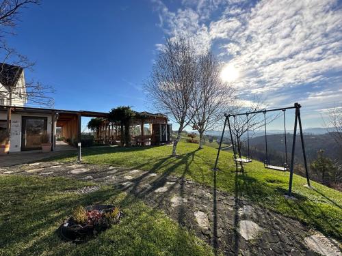 a view of a yard with a swing at B&B Villa Angelina in Rogaška Slatina
