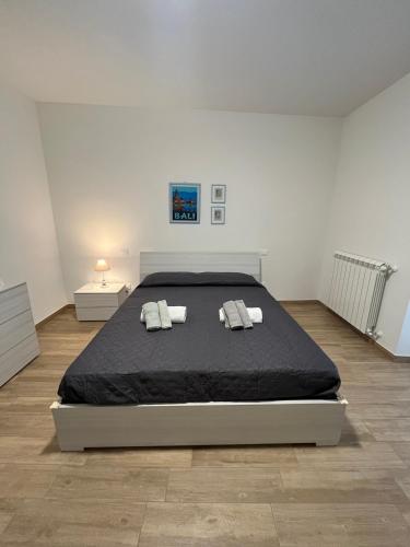 a bedroom with a large bed with two pillows at Bed&Breakfast del viaggiatore in Fondi